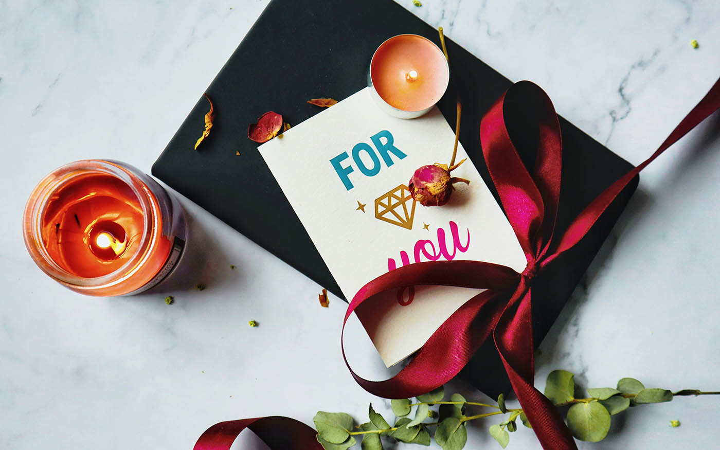 Best gifts for wife in the UK including jewellery, handbags, fragrance, spa experiences, candles, flowers, beauty tech and personalised photo books
